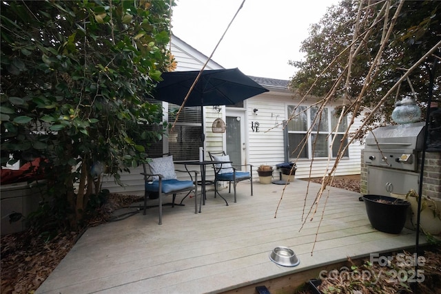 wooden terrace with grilling area