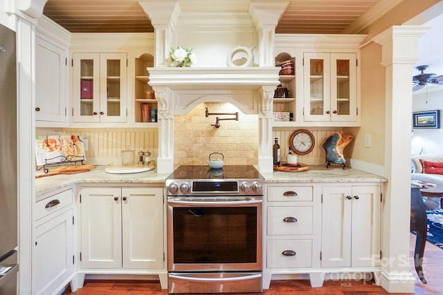 kitchen featuring light stone counters, crown molding, appliances with stainless steel finishes, decorative backsplash, and white cabinets