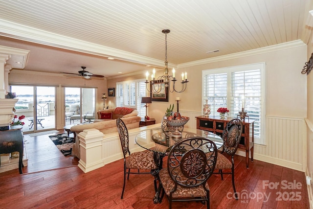 dining area featuring hardwood / wood-style flooring, crown molding, ceiling fan with notable chandelier, and wooden ceiling