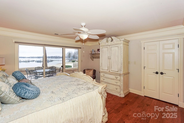 bedroom with a water view, ornamental molding, dark hardwood / wood-style floors, ceiling fan, and access to exterior