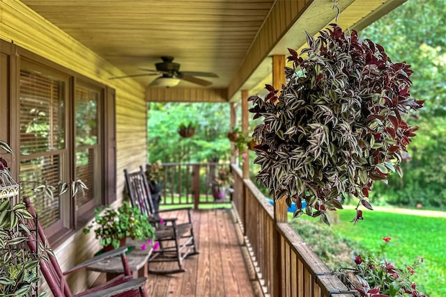 wooden deck featuring a ceiling fan and covered porch