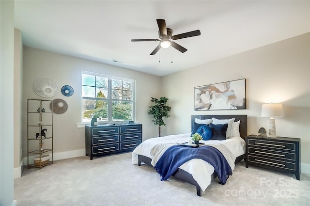 bedroom with light colored carpet and ceiling fan