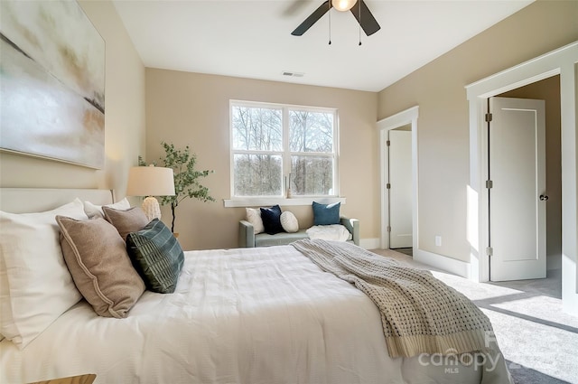 bedroom featuring light carpet and ceiling fan