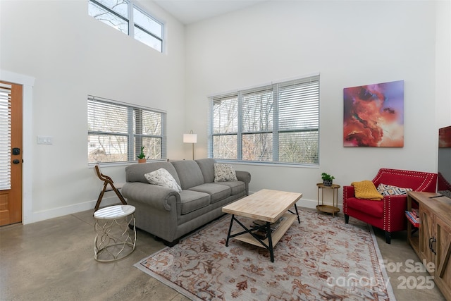 living room with a high ceiling