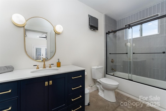 full bathroom with enclosed tub / shower combo, vanity, tile patterned flooring, and toilet