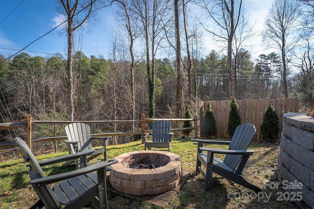 view of yard with a fire pit