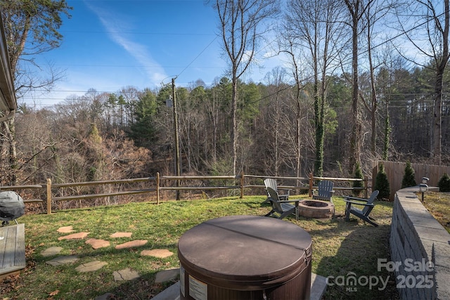 view of yard featuring a fire pit