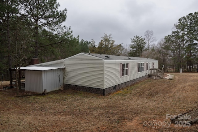 view of side of property with a yard