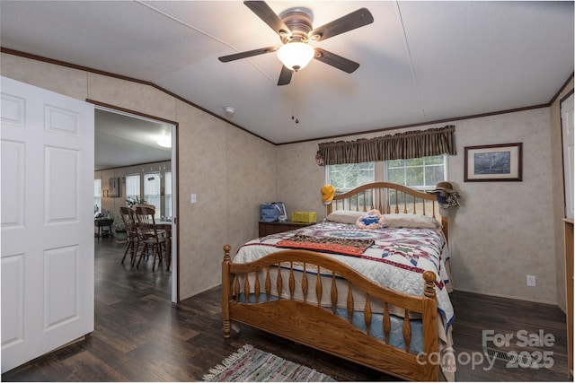 bedroom featuring dark hardwood / wood-style flooring, multiple windows, and vaulted ceiling