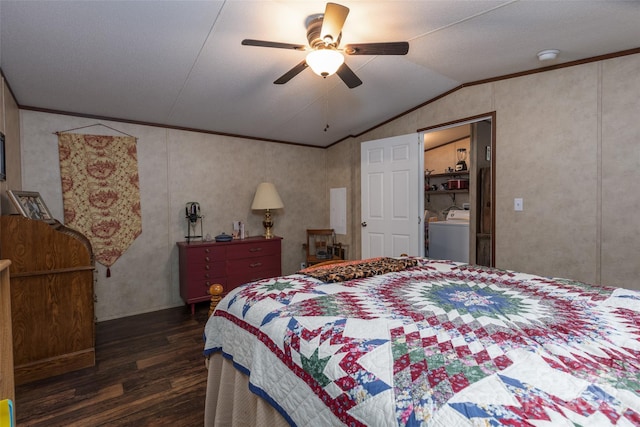 bedroom featuring washer / clothes dryer, lofted ceiling, dark hardwood / wood-style flooring, ornamental molding, and ceiling fan