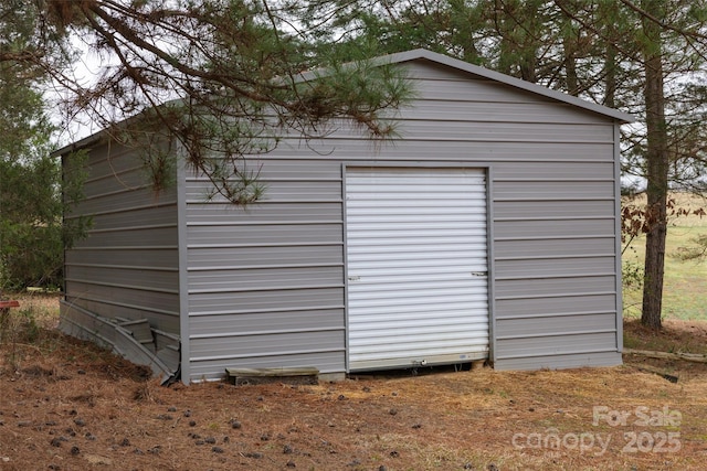 view of outdoor structure with a garage