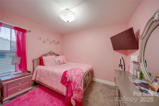 bedroom featuring light carpet