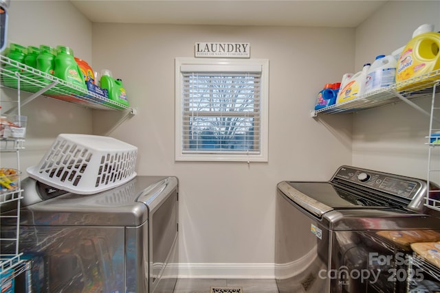 laundry area featuring washing machine and clothes dryer