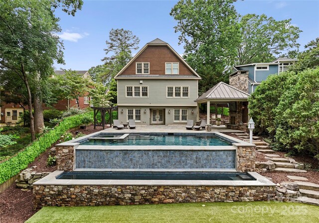2809 Glendale Rd, Charlotte, NC 28209 - back of property with french doors, a gazebo, an outdoor pool, an in-ground hot tub, and a patio area