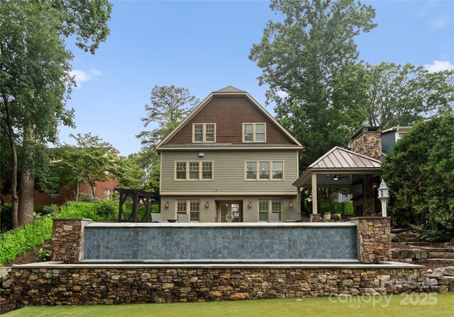 2809 Glendale Rd, Charlotte, NC 28209 - back of house featuring a gazebo and a chimney