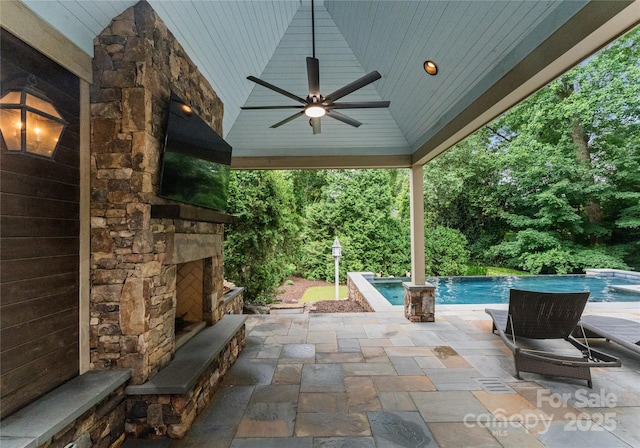 2809 Glendale Rd, Charlotte, NC 28209 - view of patio / terrace featuring an outdoor stone fireplace, ceiling fan, and an outdoor pool