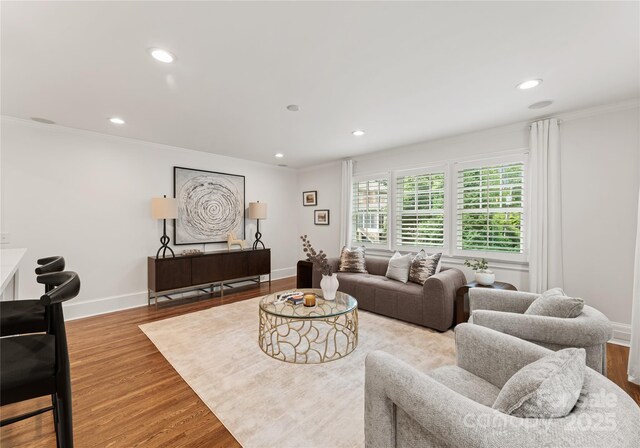 2809 Glendale Rd, Charlotte, NC 28209 - living room featuring recessed lighting, wood finished floors, ornamental molding, and baseboards