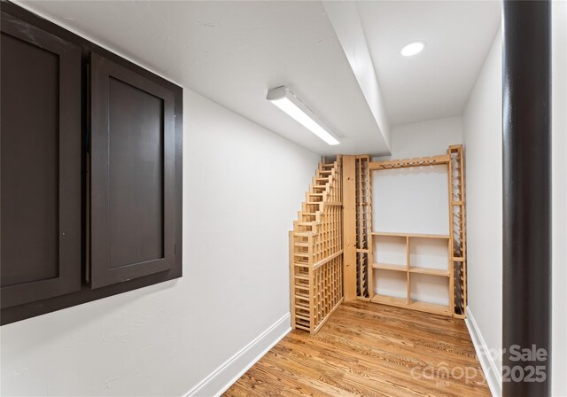 2809 Glendale Rd, Charlotte, NC 28209 - wine room featuring light wood-style flooring and baseboards