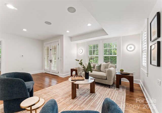 2809 Glendale Rd, Charlotte, NC 28209 - living area with light wood-style floors, baseboards, french doors, and recessed lighting