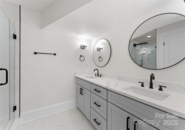 2809 Glendale Rd, Charlotte, NC 28209 - bathroom with marble finish floors, double vanity, a shower stall, and baseboards