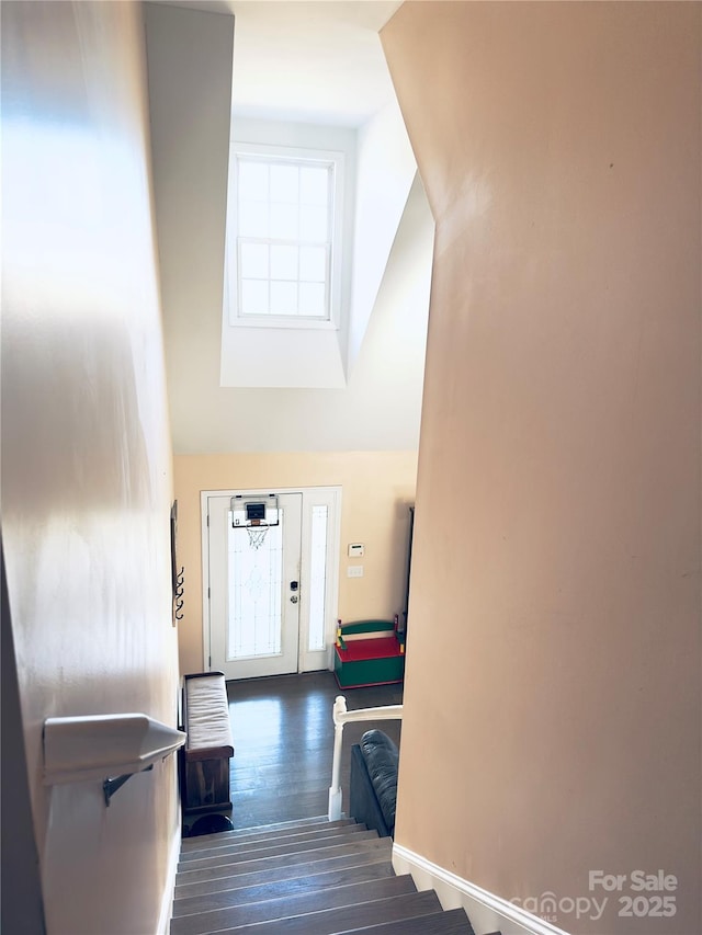 stairway featuring hardwood / wood-style flooring