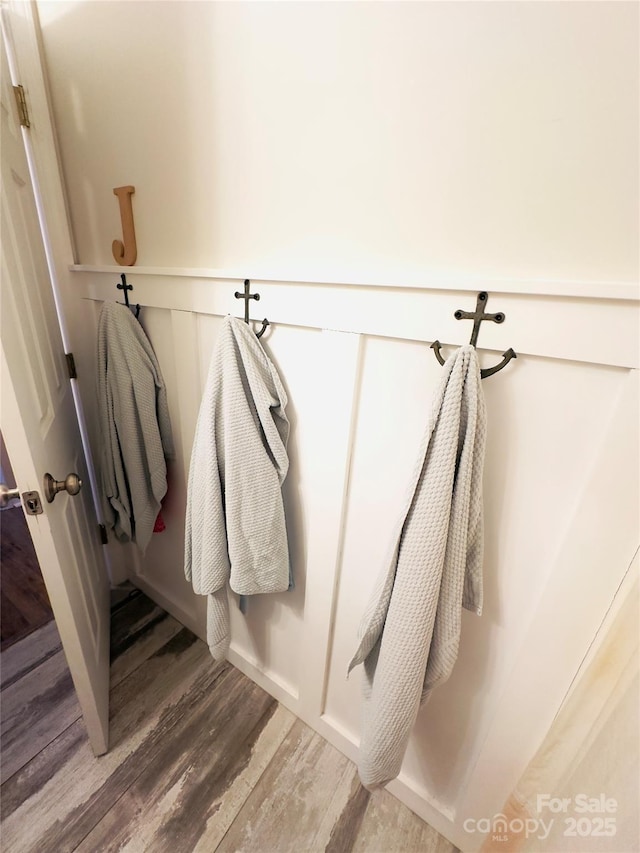 mudroom with wood-type flooring