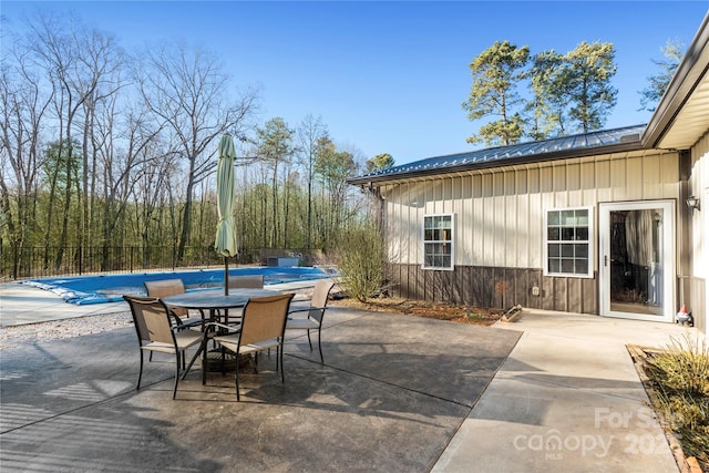 view of patio featuring a covered pool