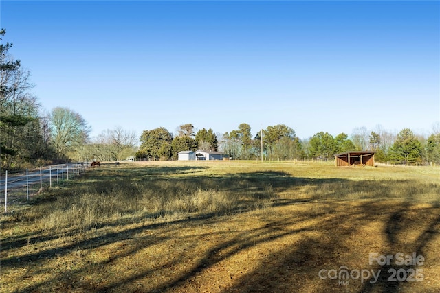 view of yard with a rural view