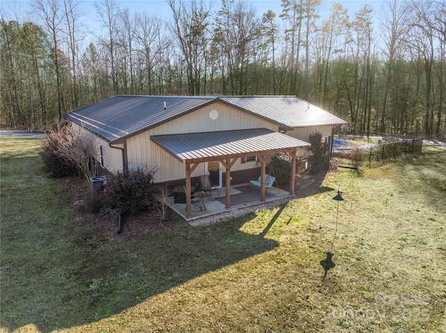 exterior space with a yard and a patio area