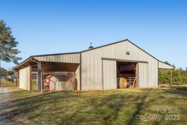 view of outbuilding with a lawn