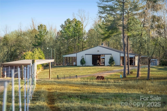 view of property's community featuring an outbuilding and a yard