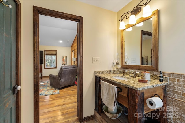 bathroom featuring vanity and hardwood / wood-style flooring