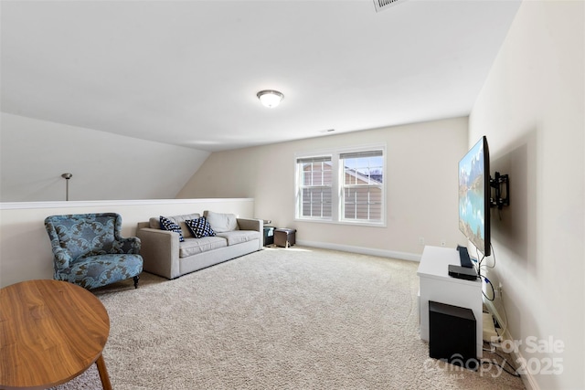 living room featuring vaulted ceiling and light colored carpet