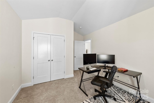 office featuring vaulted ceiling and light carpet