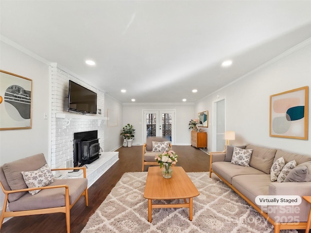 living room featuring crown molding, hardwood / wood-style flooring, and french doors