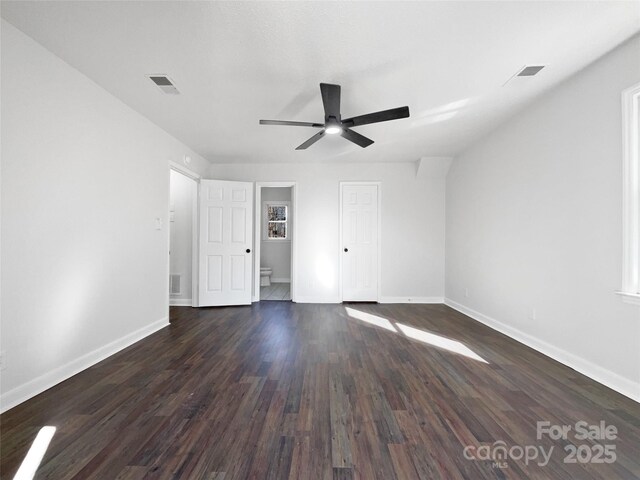 spare room featuring dark hardwood / wood-style floors and ceiling fan