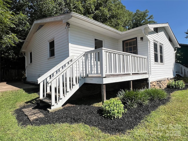 view of side of home featuring a deck