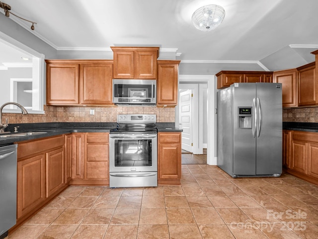 kitchen featuring sink, tasteful backsplash, light tile patterned floors, ornamental molding, and stainless steel appliances