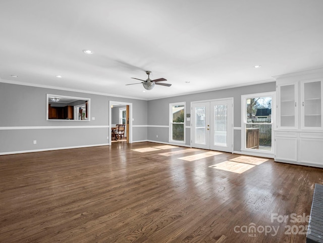 unfurnished living room featuring crown molding, dark hardwood / wood-style floors, ceiling fan, and french doors