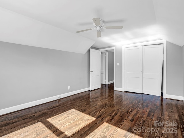 bonus room featuring ceiling fan, dark hardwood / wood-style floors, and vaulted ceiling