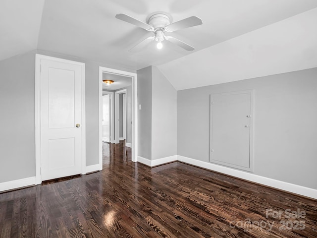 additional living space featuring lofted ceiling, dark hardwood / wood-style floors, and ceiling fan