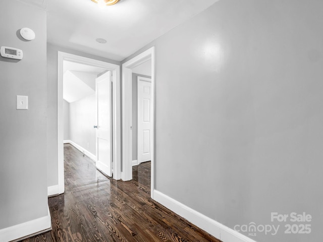 hallway featuring dark hardwood / wood-style floors