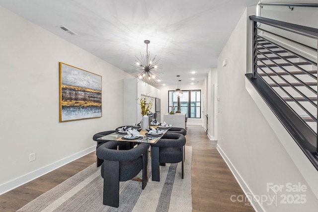 115 Verbena St NE Unit 12, Charlotte, NC 28217 - dining space with a chandelier, baseboards, and dark wood-style flooring