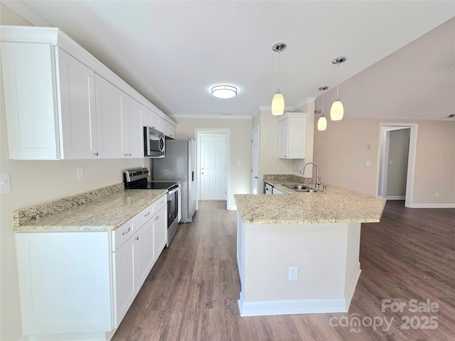 kitchen with sink, appliances with stainless steel finishes, hanging light fixtures, white cabinets, and kitchen peninsula