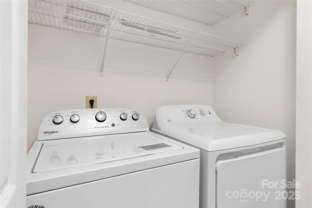 laundry area with washing machine and dryer