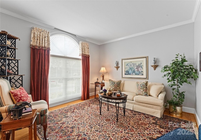 living room with hardwood / wood-style flooring, a healthy amount of sunlight, and crown molding