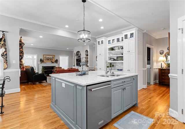 kitchen featuring white cabinetry, dishwasher, sink, gray cabinetry, and a kitchen island with sink