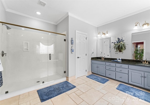 bathroom with crown molding, tile patterned floors, vanity, and a shower with shower door