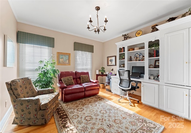 office space featuring ornamental molding, a chandelier, a healthy amount of sunlight, and light wood-type flooring