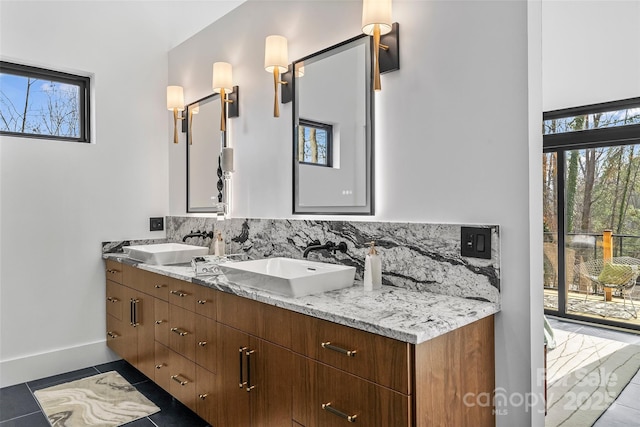 bathroom with vanity, backsplash, and tile patterned floors